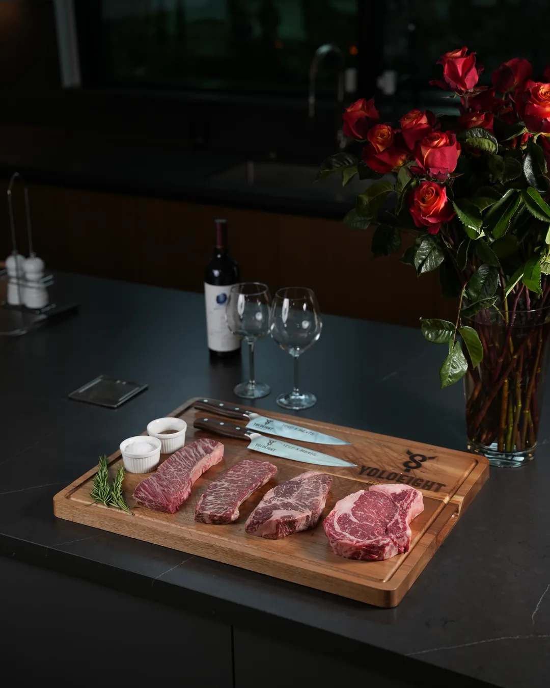 Yolo Meats cuts on a carving board at Tania’s home, with roses and wine